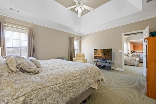 bedroom featuring ornamental molding, visible vents, light carpet, and multiple windows