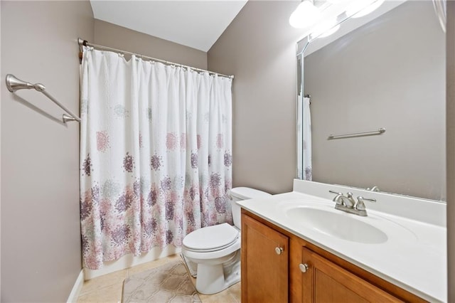 bathroom featuring vanity, tile patterned flooring, and toilet