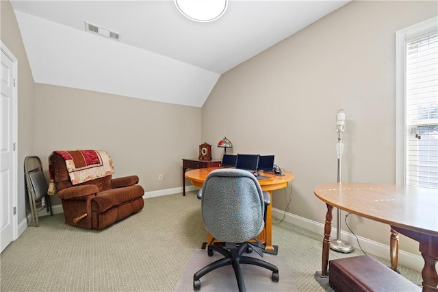 home office with lofted ceiling, carpet flooring, visible vents, and baseboards