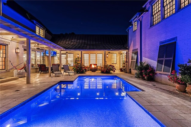 view of pool with french doors, ceiling fan, a pergola, and a patio