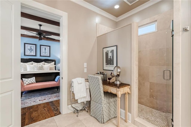 bathroom with an enclosed shower, ornamental molding, ceiling fan, beam ceiling, and tile patterned flooring