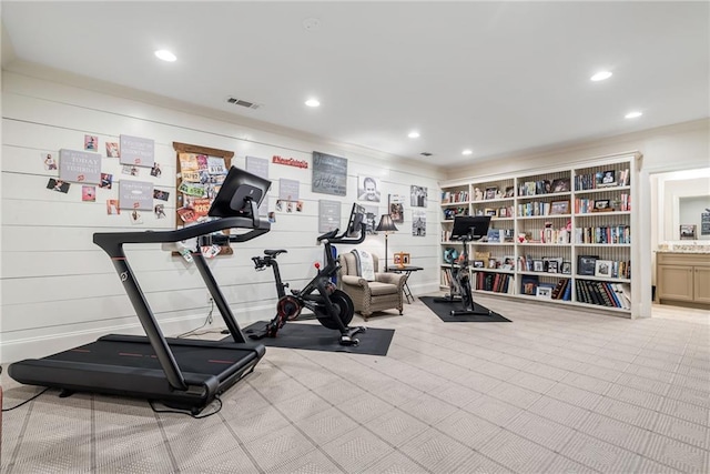 workout area featuring light carpet