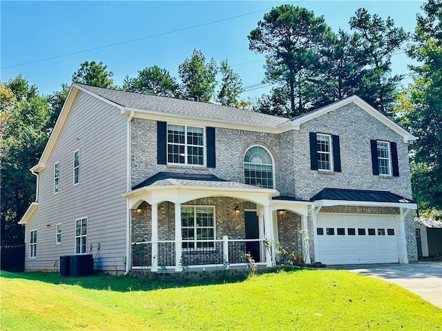 view of front of house featuring a garage, central AC, a front yard, and covered porch