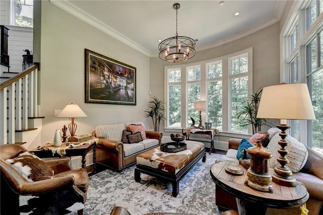 living area featuring ornamental molding and a chandelier