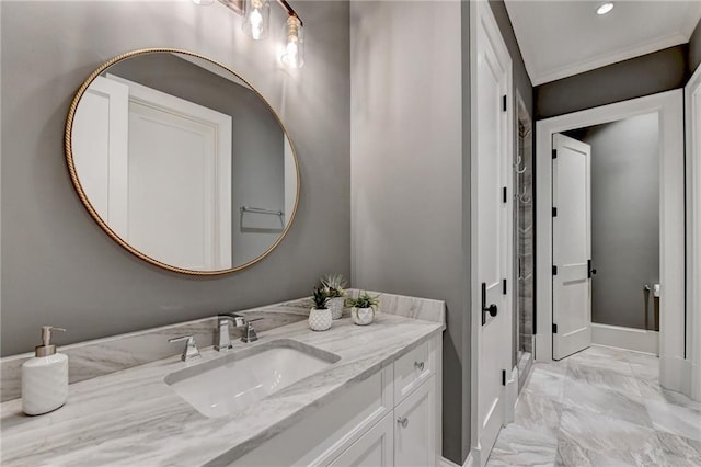 bathroom with vanity and ornamental molding