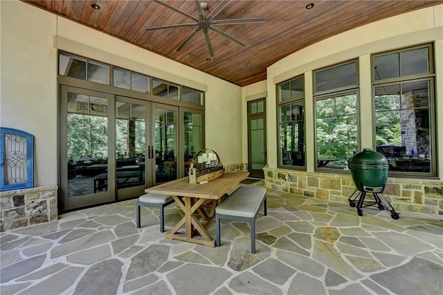 sunroom with ceiling fan, wooden ceiling, and french doors