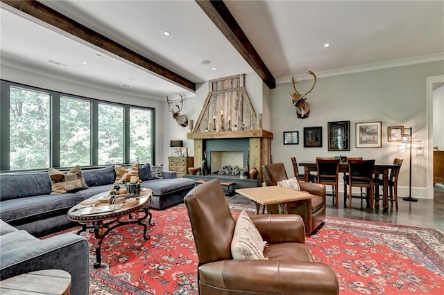 living room with beamed ceiling and crown molding