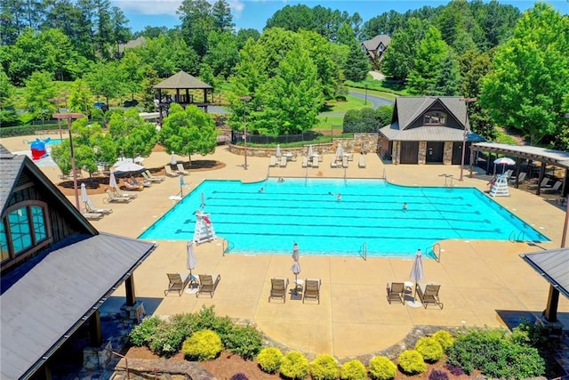 view of swimming pool featuring a gazebo and a patio