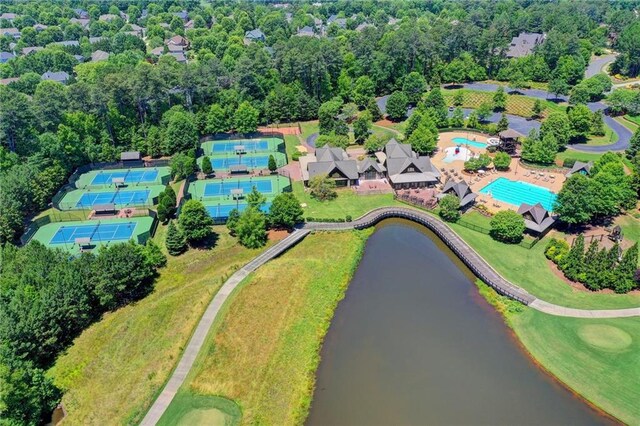 birds eye view of property with a water view