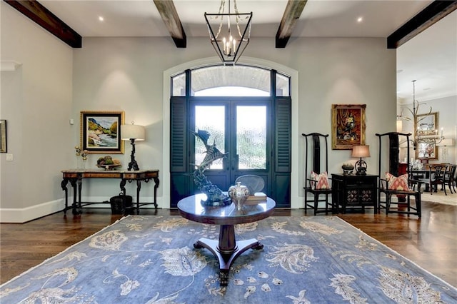 entrance foyer featuring french doors, beamed ceiling, an inviting chandelier, and dark hardwood / wood-style floors