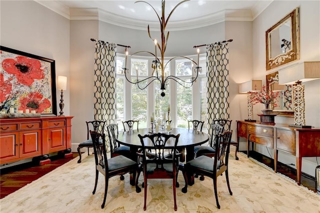 dining space with crown molding and an inviting chandelier