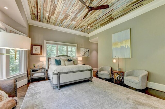 bedroom with crown molding, wooden ceiling, hardwood / wood-style floors, and ceiling fan