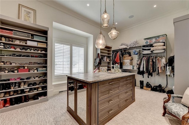 spacious closet featuring light colored carpet