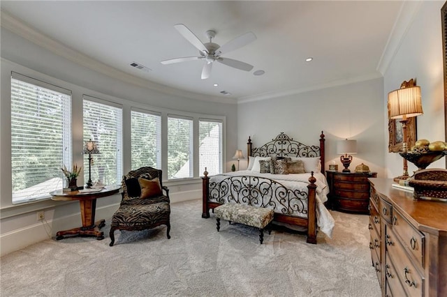 carpeted bedroom featuring crown molding and ceiling fan