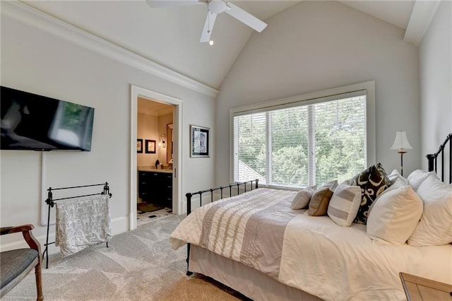 bedroom with ensuite bath, light carpet, vaulted ceiling, ceiling fan, and crown molding