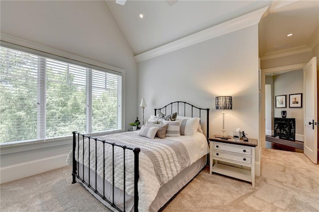 bedroom with crown molding, light carpet, high vaulted ceiling, and ceiling fan