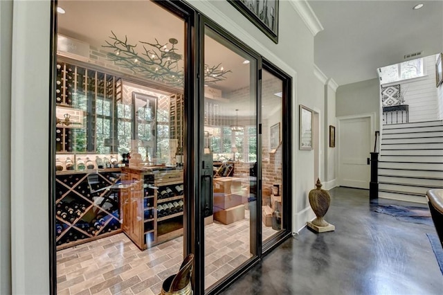 wine area with crown molding