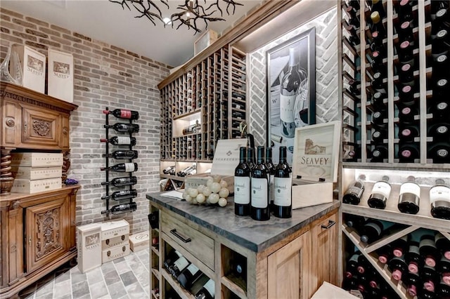 wine cellar featuring brick wall