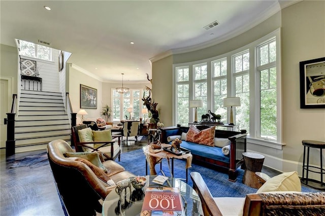 living room featuring a notable chandelier and ornamental molding