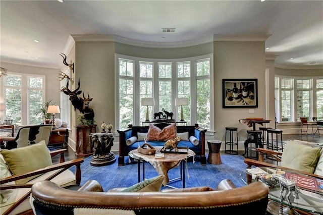 sitting room featuring wood-type flooring and ornamental molding