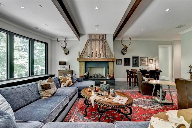 living room featuring ornamental molding and beamed ceiling