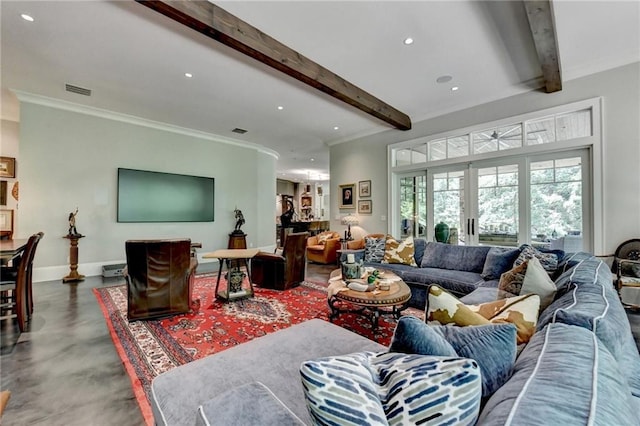 living room featuring ornamental molding, beamed ceiling, and concrete flooring