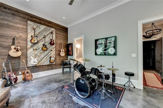 interior space with wood walls and crown molding