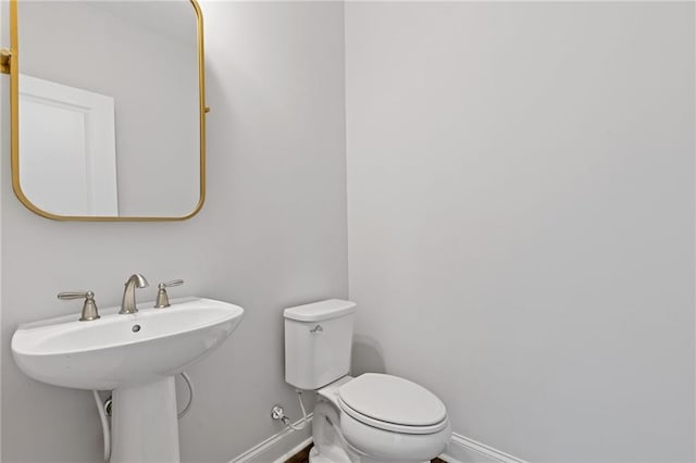 bathroom with toilet and sink