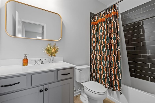 full bathroom featuring vanity, toilet, and shower / bath combo with shower curtain