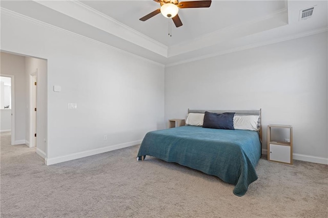 bedroom with light carpet, a raised ceiling, ceiling fan, and ornamental molding