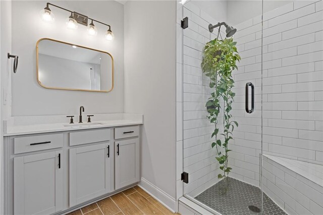 bathroom featuring vanity and walk in shower