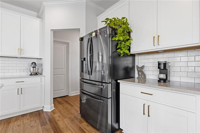 kitchen with backsplash, white cabinets, stainless steel refrigerator with ice dispenser, light stone countertops, and dark hardwood / wood-style flooring