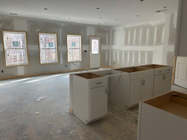 kitchen featuring a center island and white cabinetry