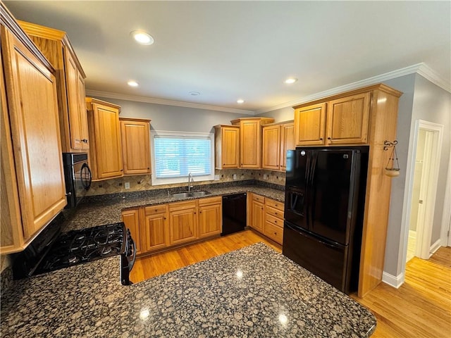 8967 Midlothian Ct, Winston, GA 30187 - kitchen featuring black appliances, a sink, backsplash, light wood finished floors, and recessed lighting