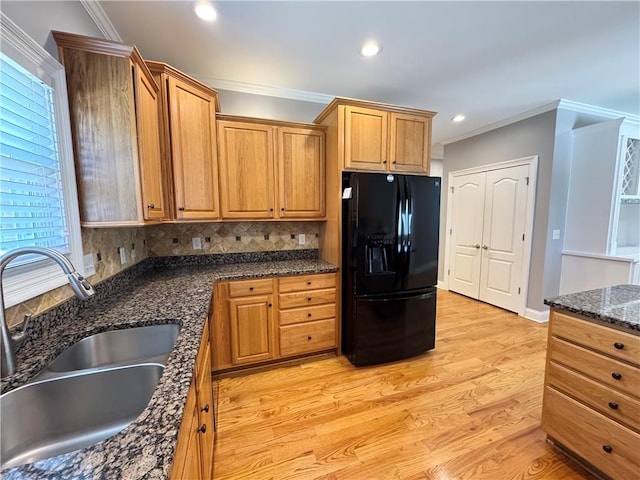 8967 Midlothian Ct, Winston, GA 30187 - kitchen featuring black refrigerator with ice dispenser, a sink, ornamental molding, light wood-type flooring, and recessed lighting