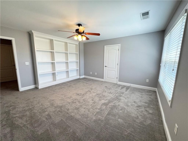 8967 Midlothian Ct, Winston, GA 30187 - unfurnished bedroom featuring multiple windows, baseboards, carpet flooring, and a ceiling fan