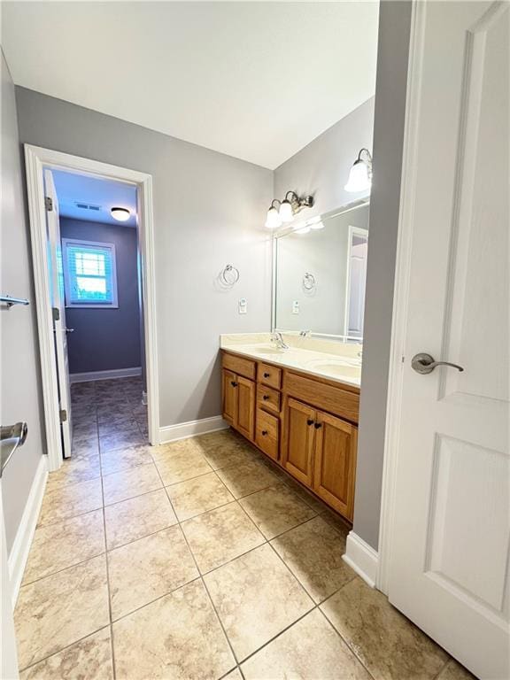 8967 Midlothian Ct, Winston, GA 30187 - bathroom with double vanity, tile patterned floors, and baseboards