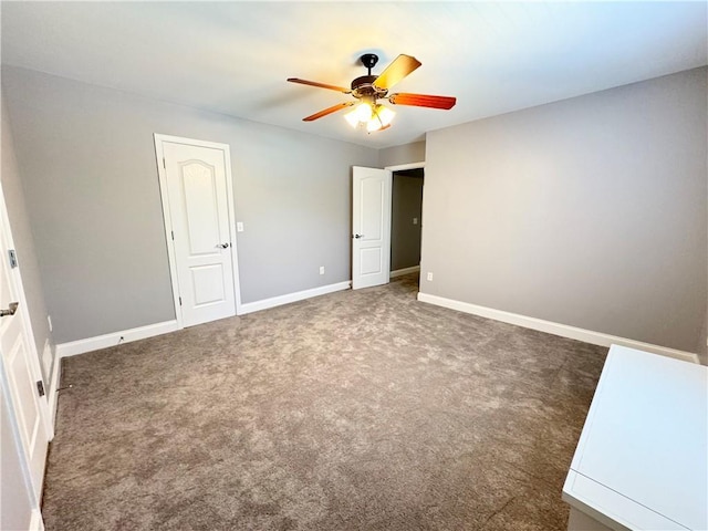 8967 Midlothian Ct, Winston, GA 30187 - unfurnished bedroom featuring baseboards, carpet, and a ceiling fan