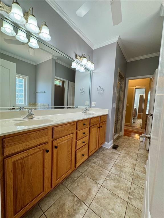 8967 Midlothian Ct, Winston, GA 30187 - full bath featuring double vanity, a stall shower, crown molding, ceiling fan, and tile patterned floors