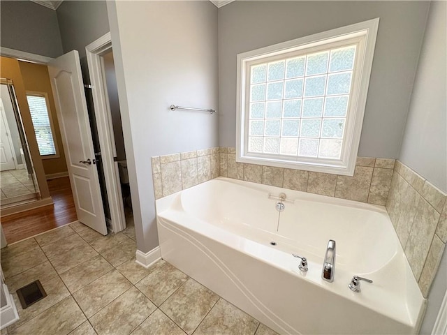 8967 Midlothian Ct, Winston, GA 30187 - full bath featuring a bath, baseboards, and tile patterned flooring