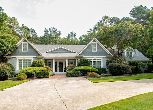 view of front of property with a front lawn and french doors