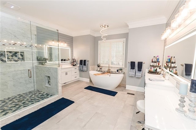 full bath featuring a shower stall, two vanities, ornamental molding, a soaking tub, and a sink