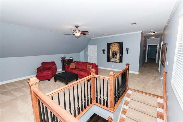 living room with visible vents, carpet floors, baseboards, and ceiling fan