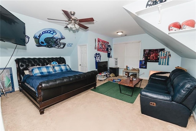 bedroom with carpet flooring, baseboards, a ceiling fan, and vaulted ceiling