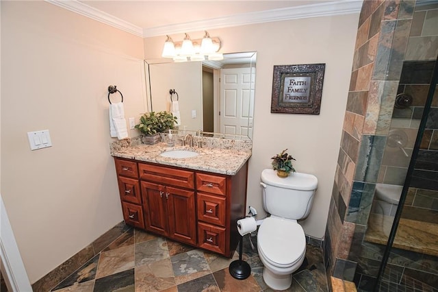 bathroom with vanity, a tile shower, stone tile flooring, ornamental molding, and toilet