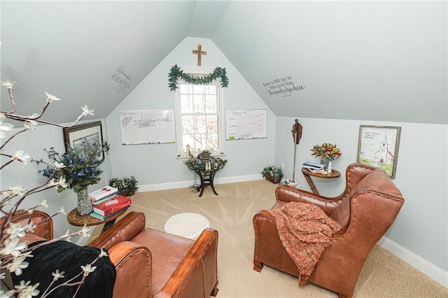 sitting room featuring baseboards, carpet, and vaulted ceiling