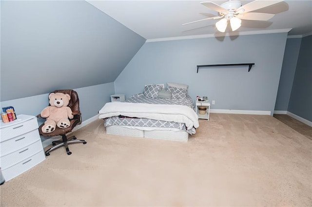 bedroom featuring a ceiling fan, carpet, baseboards, vaulted ceiling, and crown molding