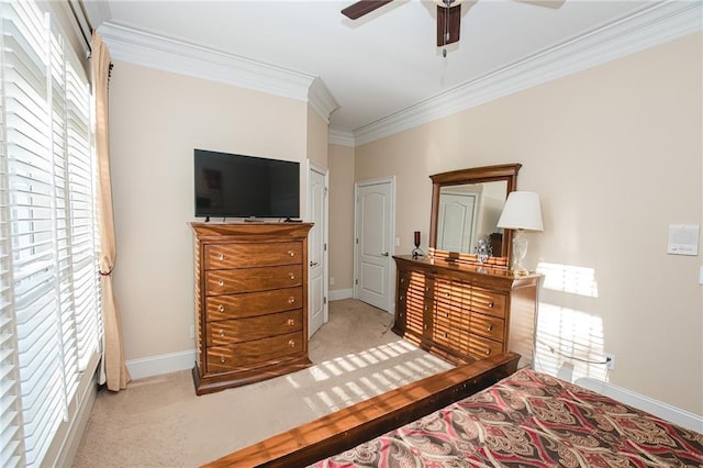 bedroom with carpet flooring, baseboards, ceiling fan, and crown molding