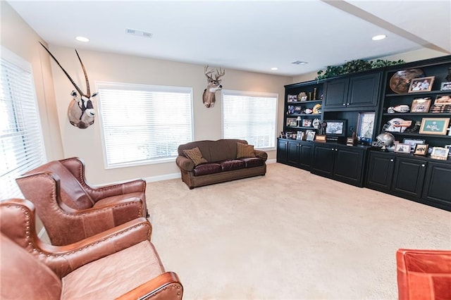 living room with recessed lighting, visible vents, carpet floors, and baseboards