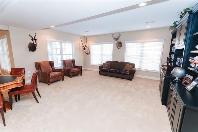 living area featuring recessed lighting, visible vents, light colored carpet, and baseboards